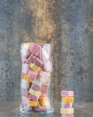 Candy jar full with jelly candies. Vertical photo. High quality photo